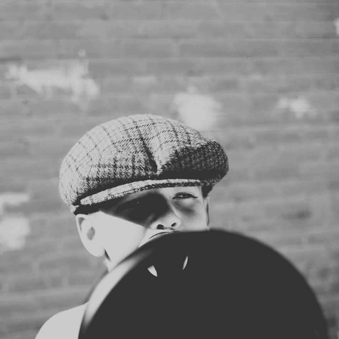 Get Support as You Grow your Biz - image of vintage b&w boy with megaphone